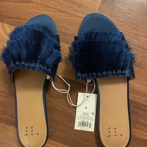 Blue tassels flat sandals size 8.5
Another day brand
